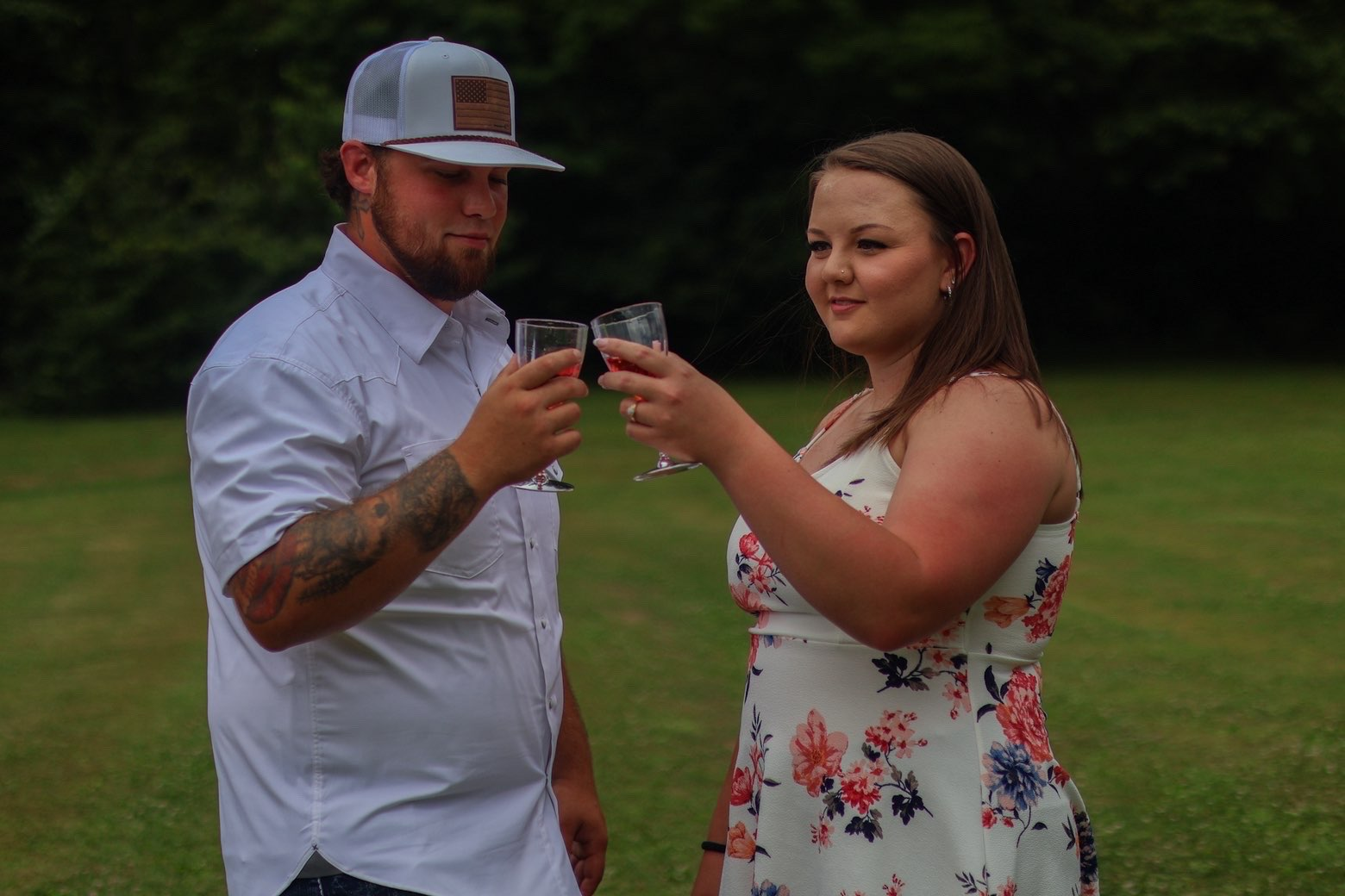 Couple toasting glasses to celebrate their engagement